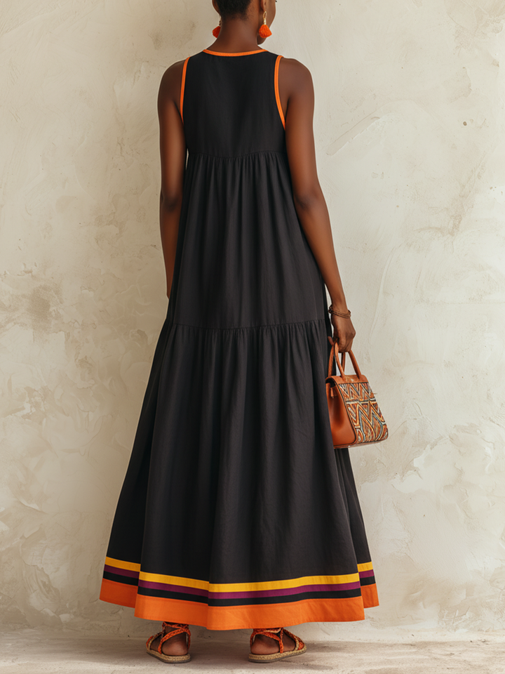 Federica | Abito maxi nero a balze con bordino arancio e orlo multicolor